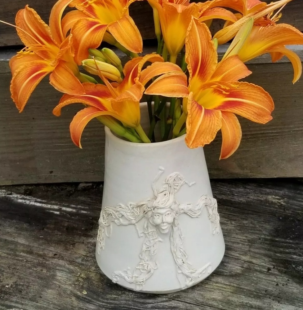 Hand thrown woman's dimensional face vase